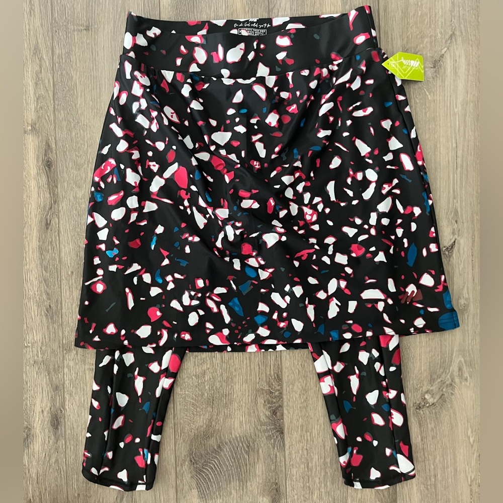Mod sportswear skirt with built in leggings. Multi color geometric shapes print